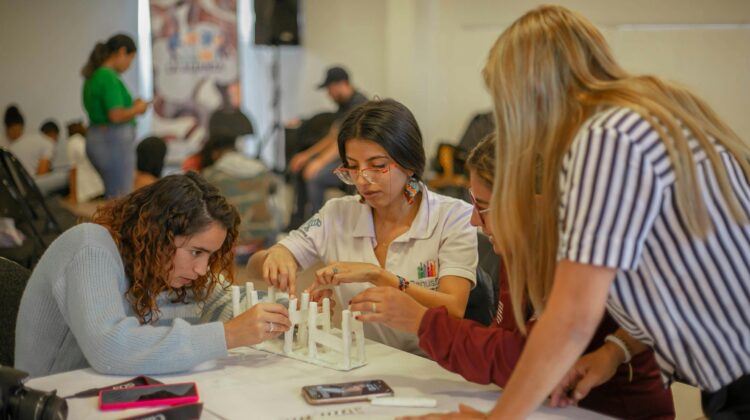 A group of students working together to build a model